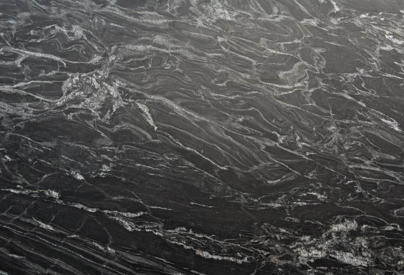 A close up image of Nero Tempesta, a black natural granite